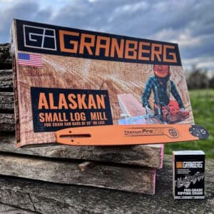 An Alaskan small log mill, a Chainsaw Bar, and a Ripping Chain sit on the roadside.